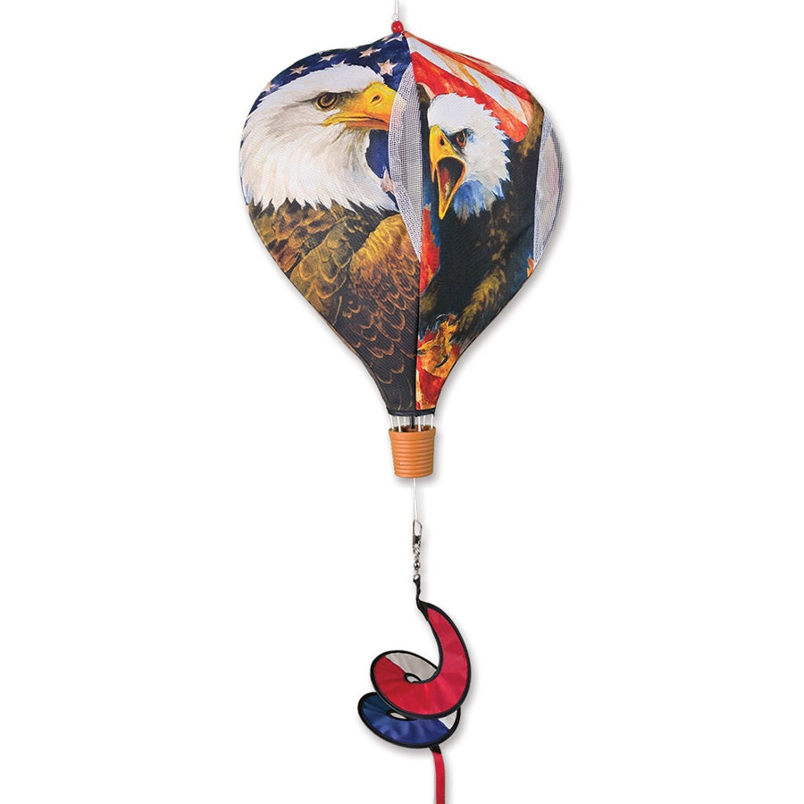 19 in. Pop-Open Hot Air Balloon - Patriotic Eagle spinning gracefully in the wind, showcasing a vibrant eagle design in an outdoor setting.