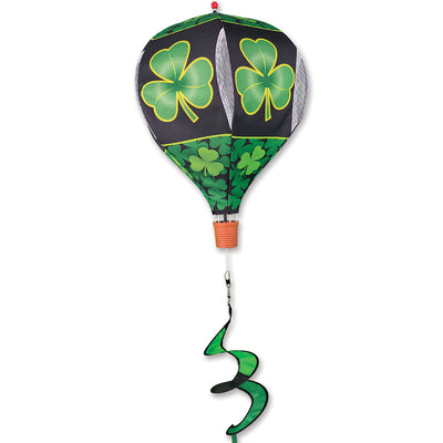 19 in. Pop-Open Hot Air Balloon featuring a shamrock design, displayed outdoors, spinning gracefully in the wind against a clear sky.