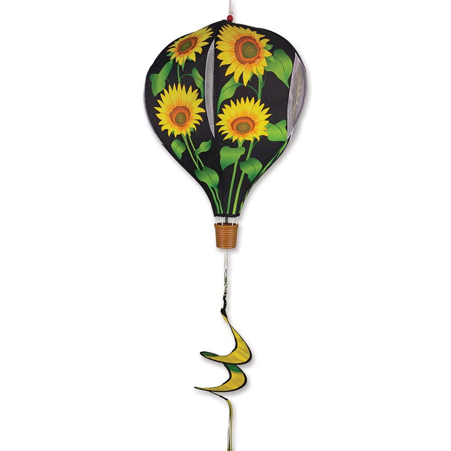 19 in. Pop-Open Hot Air Balloon with sunflower design spinning in the air, displayed on a porch, showcasing its vibrant colors against a sunny background.