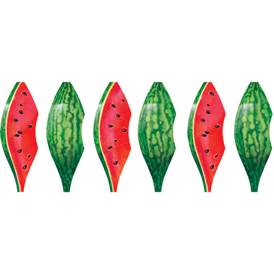 Vibrant 19 in. Pop-Open Hot Air Balloon in Watermelon design displayed in a garden setting, spinning gently in the breeze.