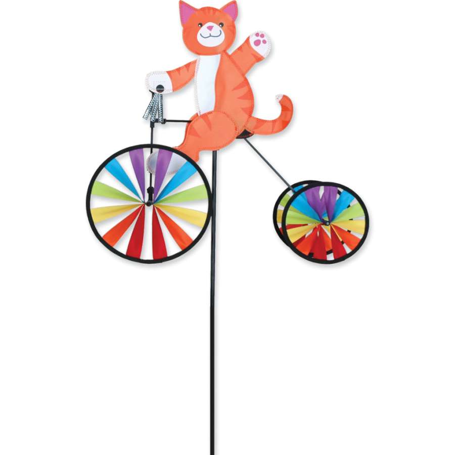 Colorful 19 in. Tricycle Spinner with shiny silver tassels displayed in a garden setting, spinning cheerfully in the breeze.