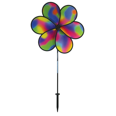 19-inch Jewel Flower Spinner with vibrant rainbow flower design, spinning gracefully in a garden setting under bright sunlight.