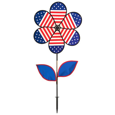 19-inch Patriotic Flower with Leaves spinning outdoors, showcasing bright stars and stripes petals attached to a sturdy fiberglass pole.