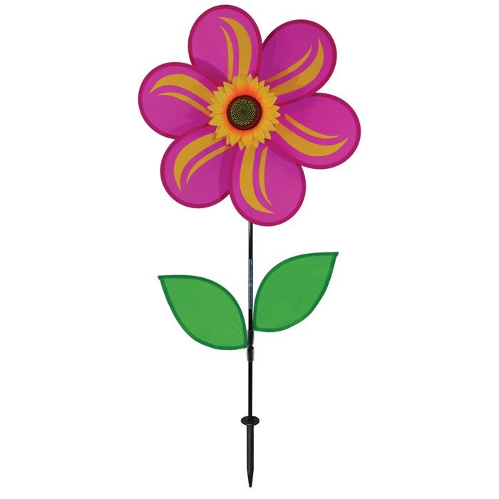 19-inch pink sunflower spinner with six petals, realistic sunflower center, and two green leaves, mounted on a sturdy fiberglass pole in a garden setting.