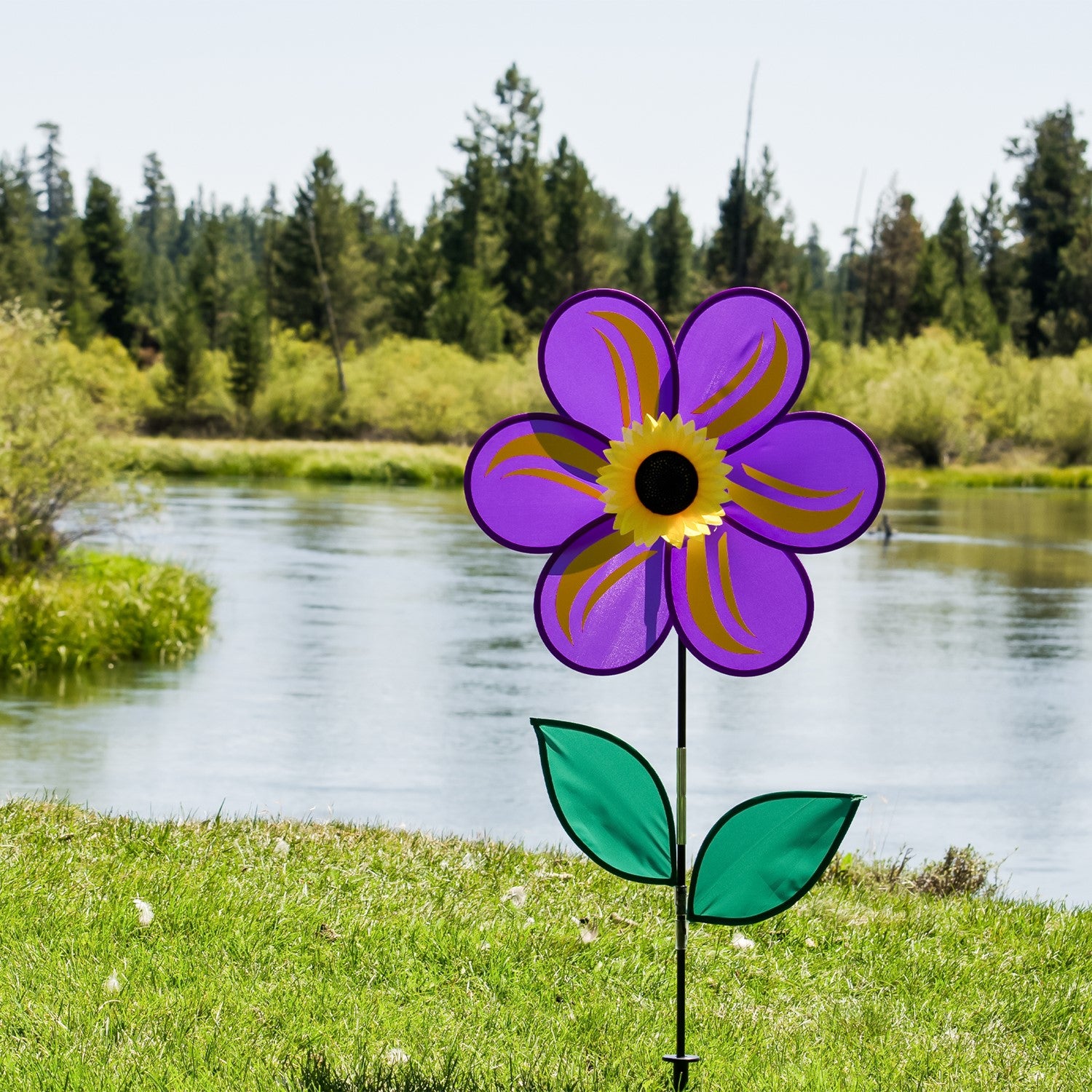 19-inch Purple Sunflower Spinner with six vibrant petals and leaves, rotating gently in a garden setting, designed for outdoor decor.