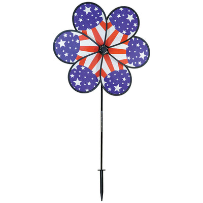 19\" Patriot Star Flower Spinner featuring vibrant stars and stripes design, displayed in a garden setting, spinning gently in the breeze.