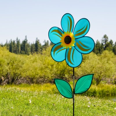 19-inch teal sunflower spinner featuring six petals and green leaves, rotating in a garden setting with a bright blue sky background.
