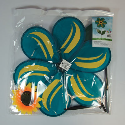 19-inch teal sunflower spinner featuring six petals and green leaves, rotating in a garden setting with a bright blue sky background.