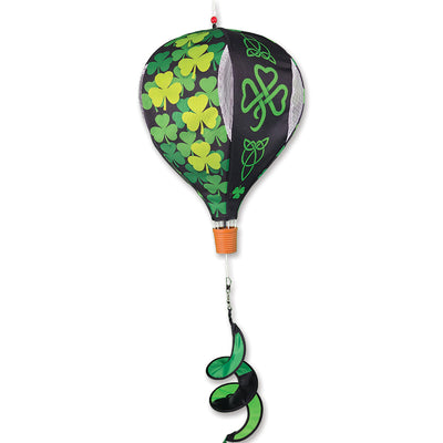 19 in. Pop-Open Hot Air Balloon featuring Celtic shamrocks, displayed spinning in the wind on a sunny porch.
