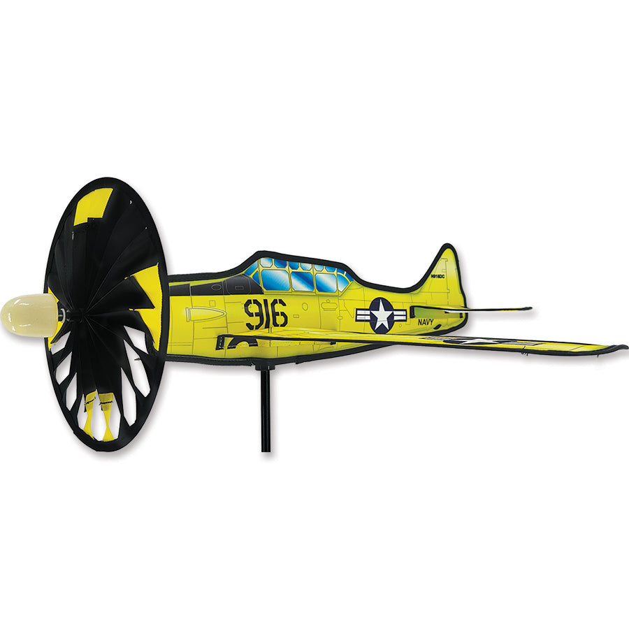 20 in. Airplane Spinner - Texan T6 features intricate details and vibrant colors, displayed gracefully spinning in a garden setting.