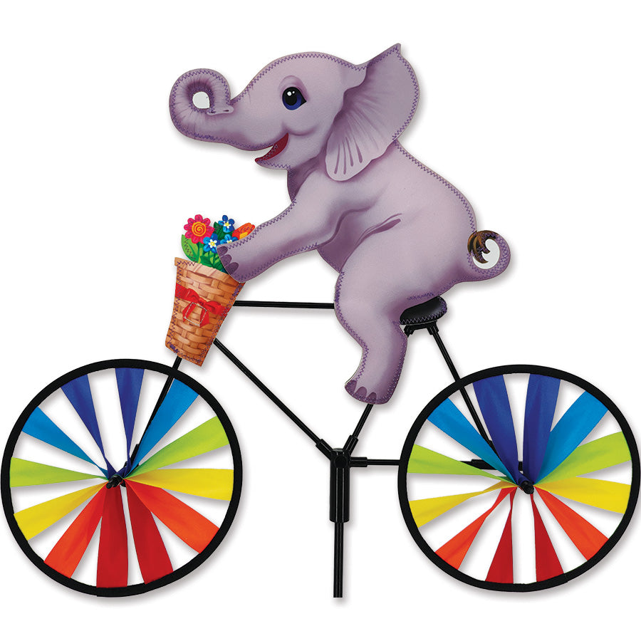 20-inch Baby Elephant Bike Spinner made from SunTex fabric, featuring vibrant colors and a fun design, spinning gently in a garden setting.