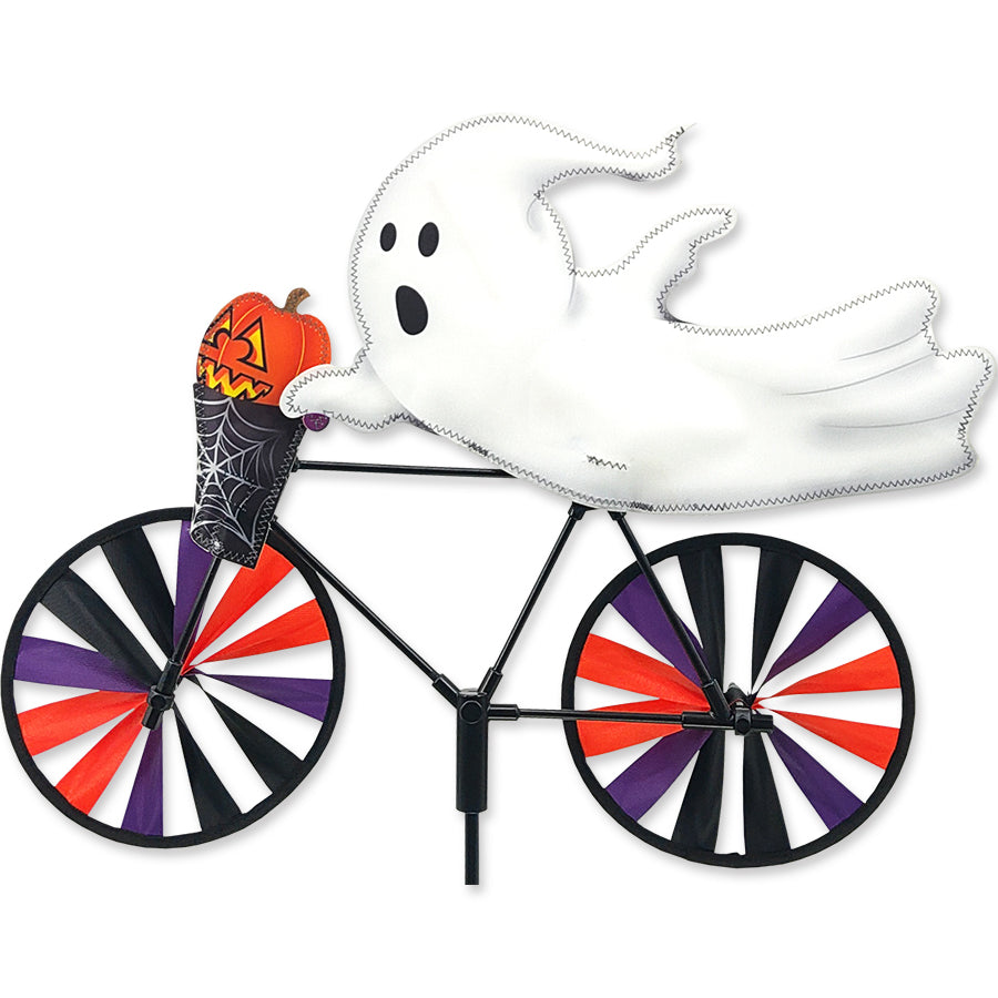 Colorful 20 in. Bike Spinner featuring a playful ghost design, elegantly spinning in a garden setting.