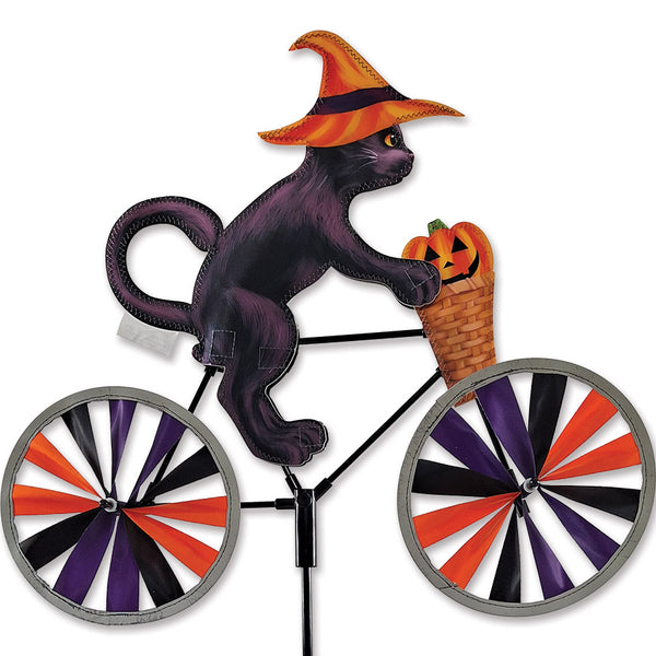 20 in. Bike Spinner featuring a whimsical Halloween Cat design, reflecting light for visibility, mounted on a bicycle wheel with a vibrant background.