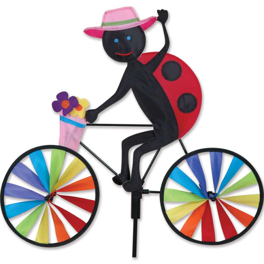 20 in. Bike Spinner - Ladybug with vibrant red and black colors spinning gracefully in an outdoor garden setting.