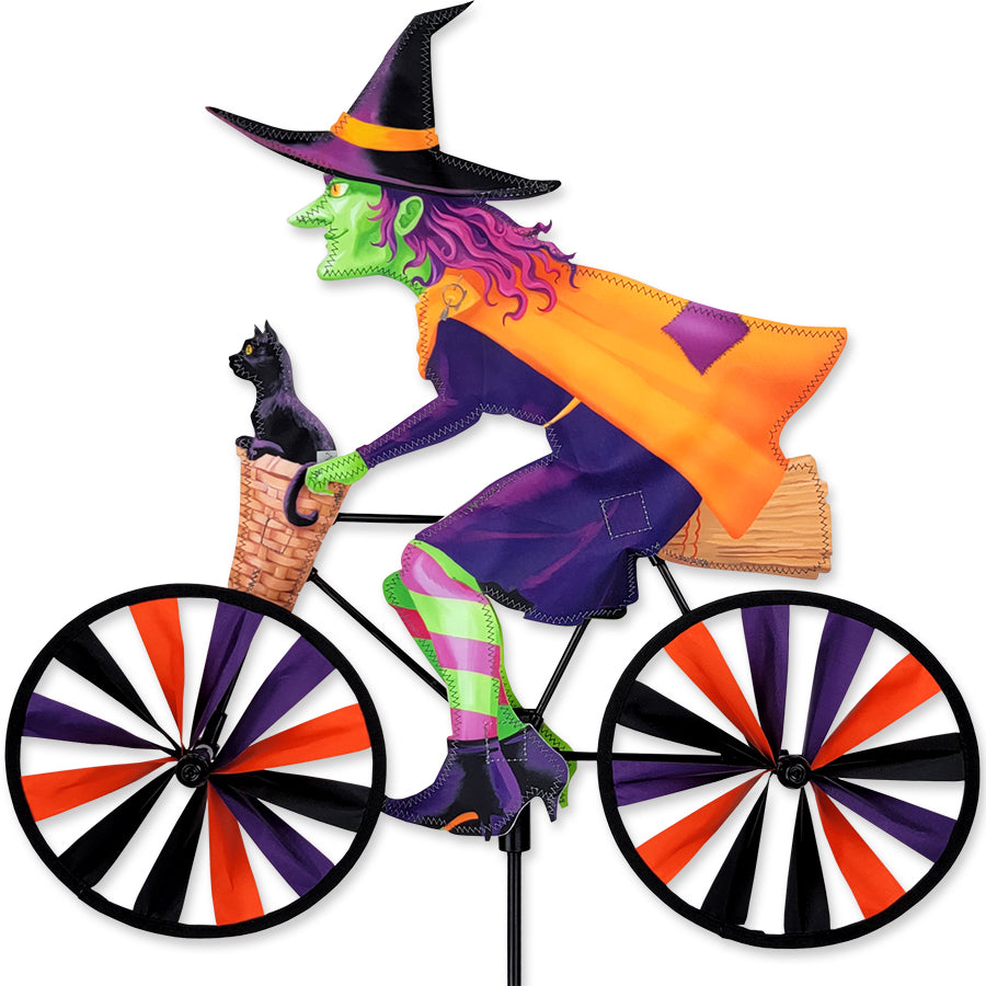 20 in. Bike Spinner - Witch with colorful design displayed outdoors spinning in the breeze, perfect for seasonal decor.