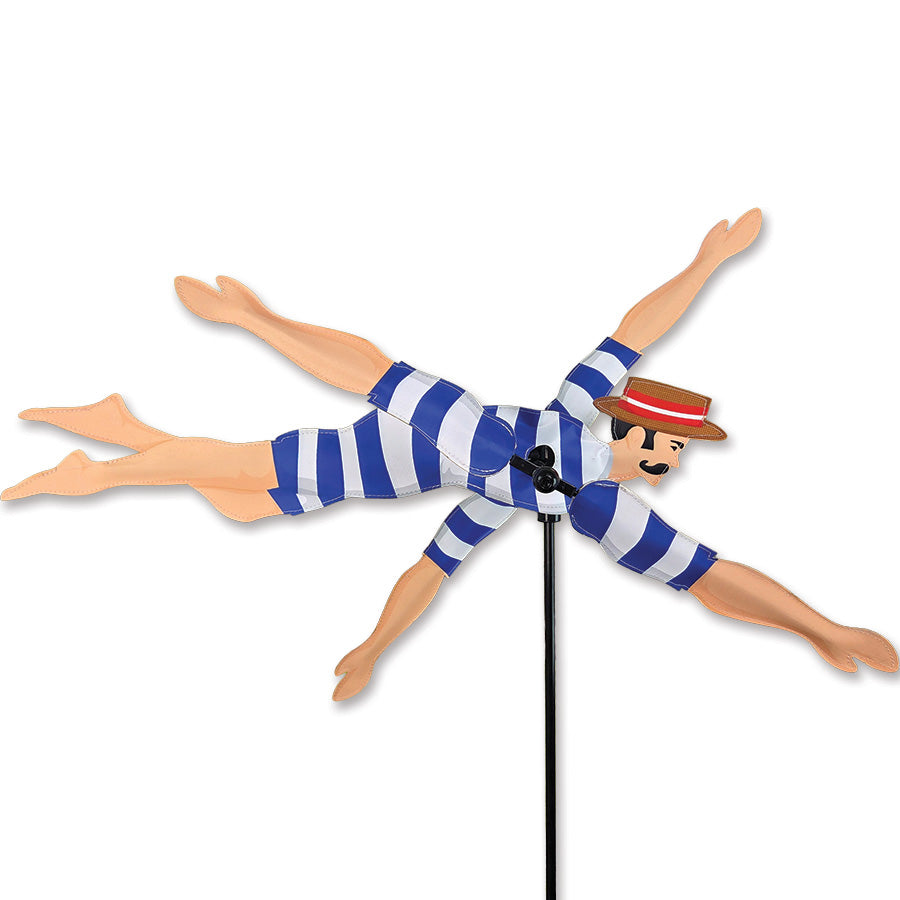 20 in. WhirliGig Spinner featuring a Blue Victorian Swimmer design, made from durable SunTex fabric, spinning gracefully in a garden.
