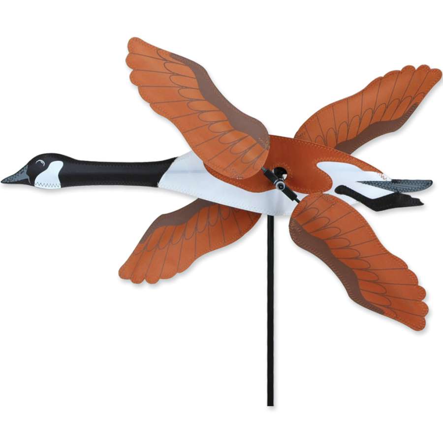 20 in. WhirliGig Spinner featuring a Canadian Goose design, spinning elegantly in a garden setting under clear blue skies.