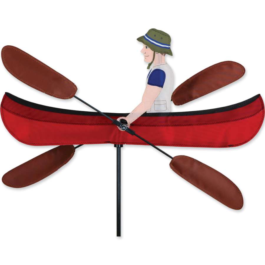 20 in. WhirliGig Spinner featuring a vibrant canoe design spinning in a light breeze, adding whimsical charm to a garden setting.