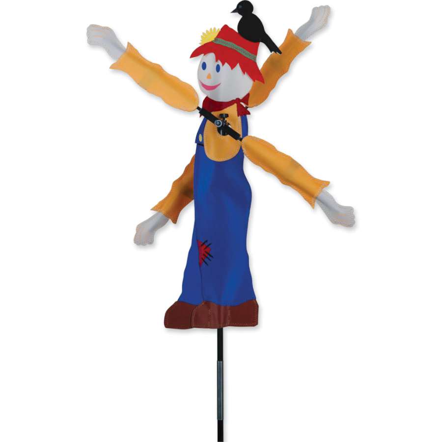 20 in. WhirliGig Spinner featuring a bright scarecrow design spinning delightfully in a gentle breeze in a garden setting.