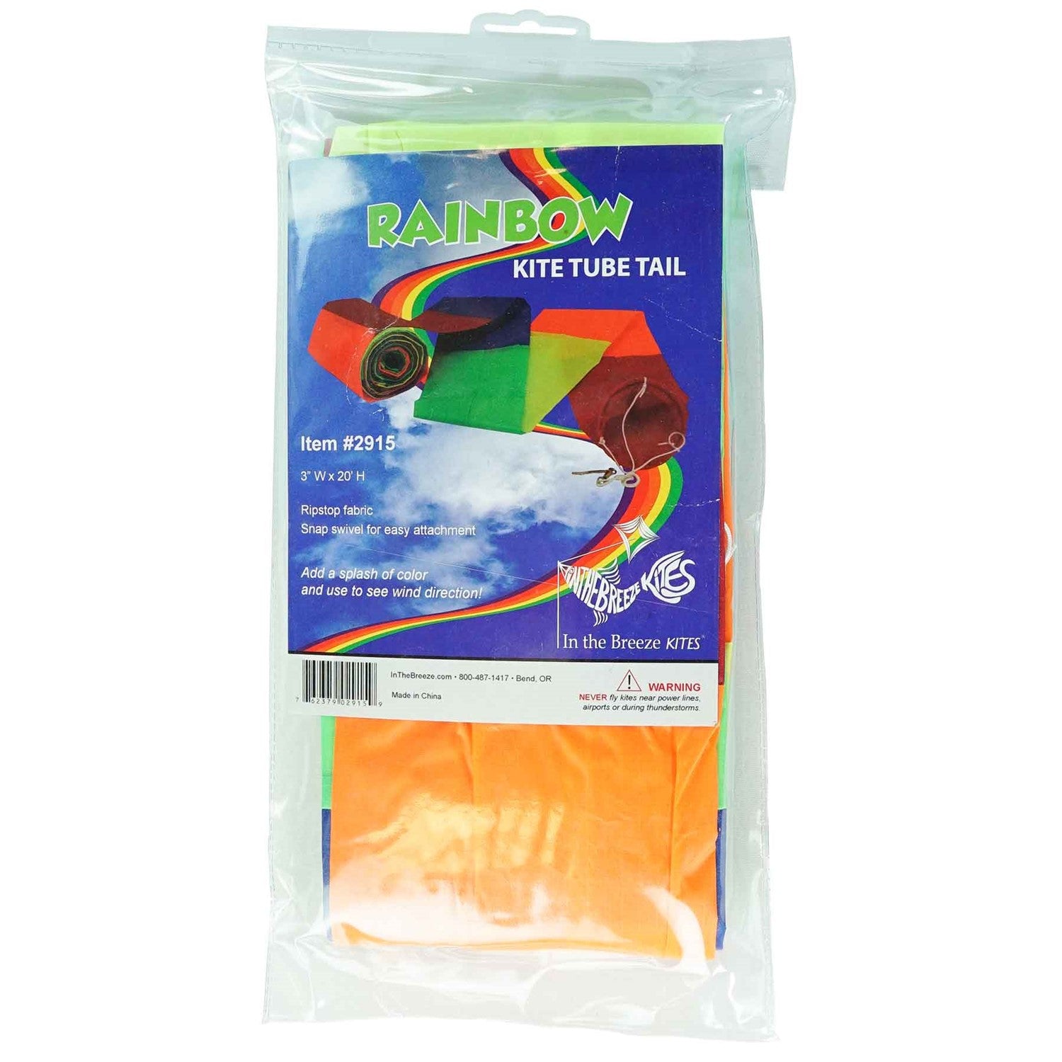 20' Rainbow Tube Tail featuring vivid rainbow stripes designed to enhance kite displays, showcased in an outdoor setting with a clear sky.