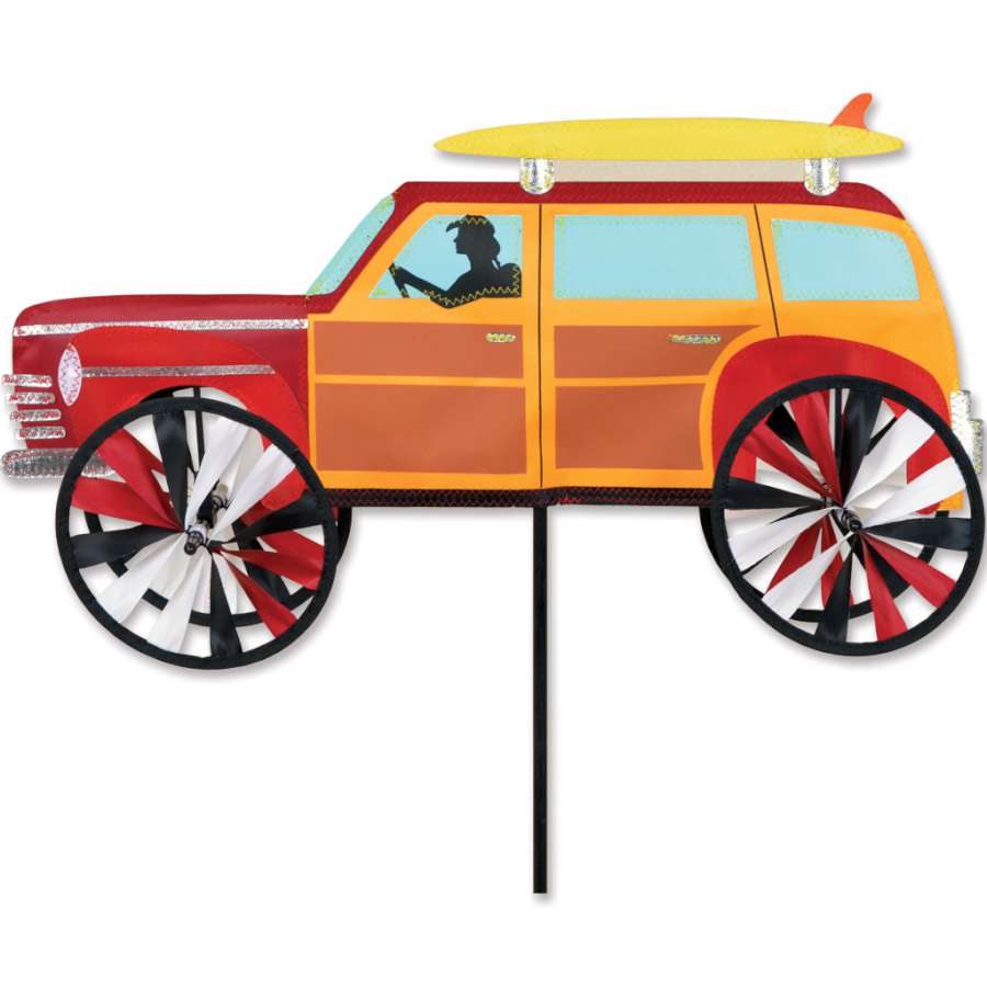 21 in. Woody Spinner featuring bright surf-inspired colors, gracefully spinning outdoors in a sunny garden setting.