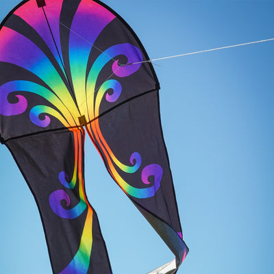 22" Aurora Dancing Dragon Kite with vibrant colors and flowing tails, soaring gracefully against a blue sky, ready for outdoor adventures.
