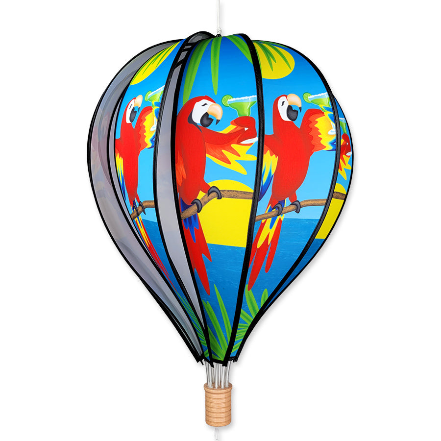 22 in. Hot Air Balloon - 5 O'Clock spinning in a garden, featuring bright colors and intricate details against a natural backdrop.