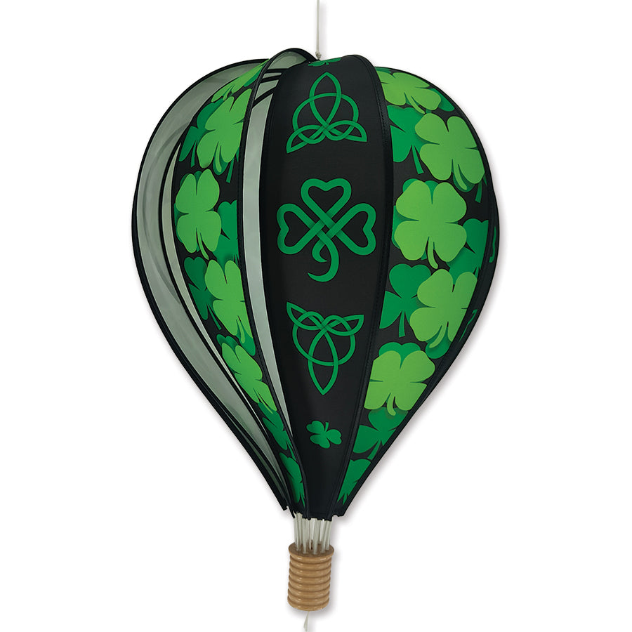 22 in. Hot Air Balloon featuring vibrant Celtic Shamrocks design hanging outdoors, spinning gently in the breeze against a clear sky.