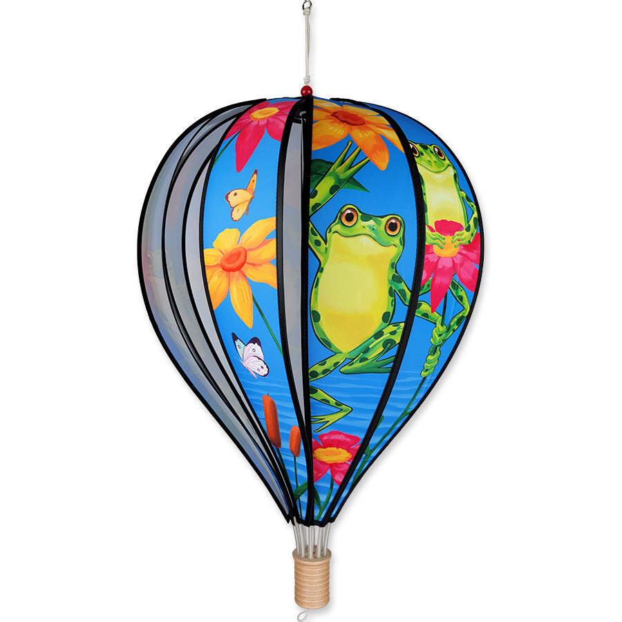 22 inch spinning hot air balloon with frog design hanging outdoors, showcasing its bright colors and whimsical appearance.