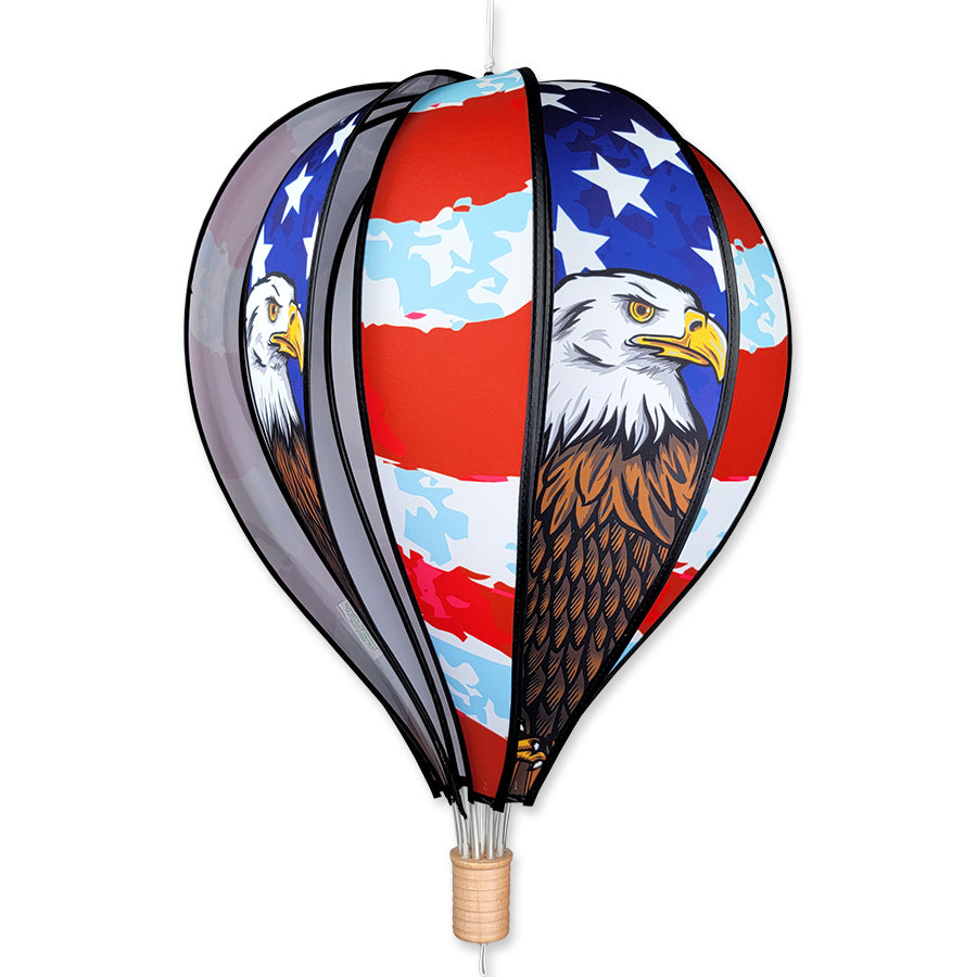 22 in. Hot Air Balloon showcasing a vibrant Patriotic Eagle design, spinning in a garden setting, symbolizing American pride.