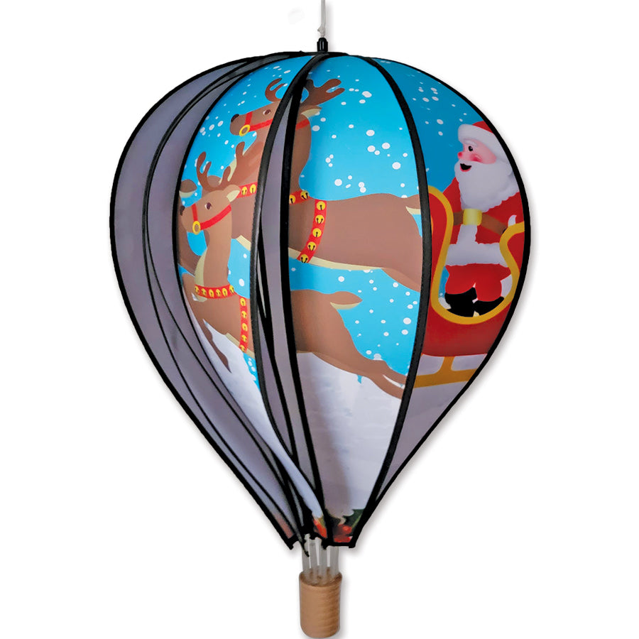 Brightly colored 22 in. Hot Air Balloon featuring Santa and sleigh, displayed outside, spinning to add festive cheer to holiday decorations.