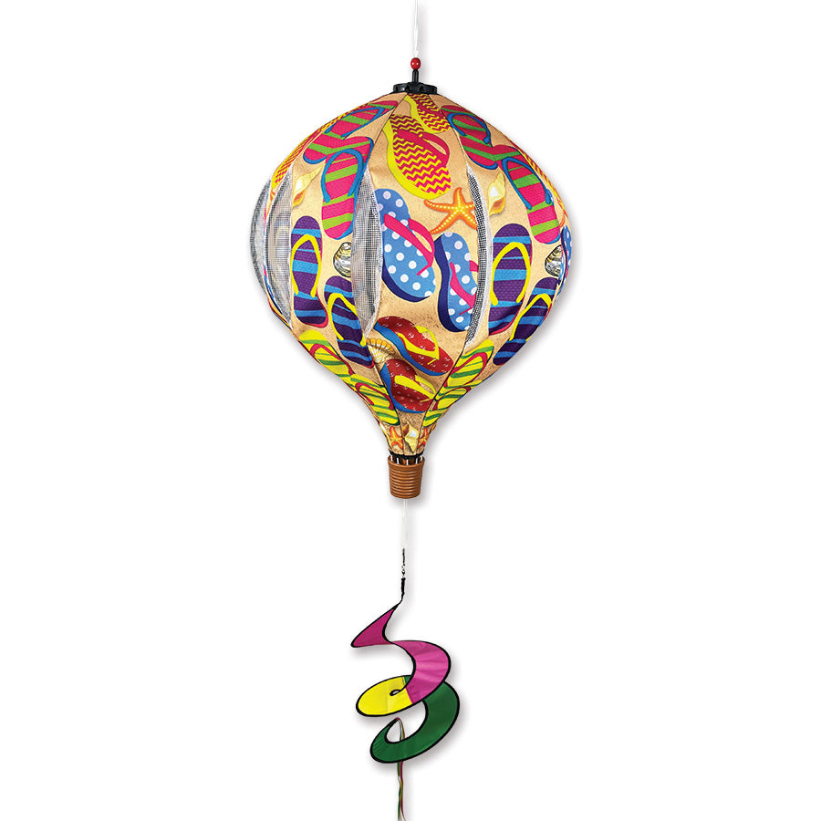 22 in. Pop-Open Hot Air Balloon wind spinner in vibrant colors displayed on a porch, spinning gracefully in the breeze.