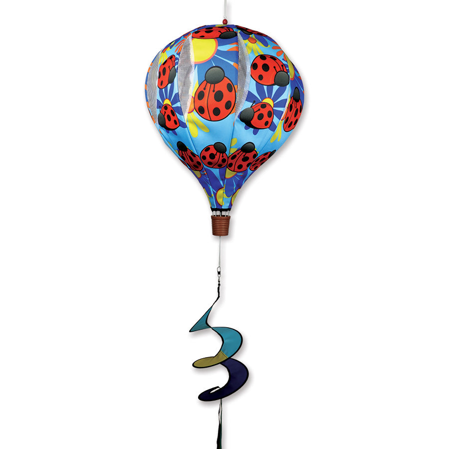 22 in. Pop-Open Hot Air Balloon featuring a ladybug design, spinning gently in the wind on a sunny deck, showcasing vibrant colors.