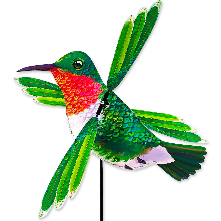 22 in. WhirliGig Spinner in Hummingbird design displaying vibrant colors, spinning in the breeze within a beautiful garden setting.