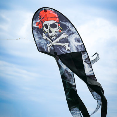 22 inch Smokin' Pirate Dancing Dragon Kite flying in the air with vibrant pirate and dragon designs, showcasing long flowing tails in a clear sky.
