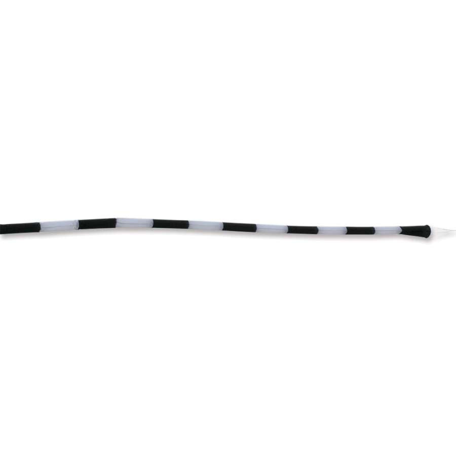 24 ft. black and white Tube Tail elegantly flowing in the wind attached to a windsock pole in an outdoor setting.