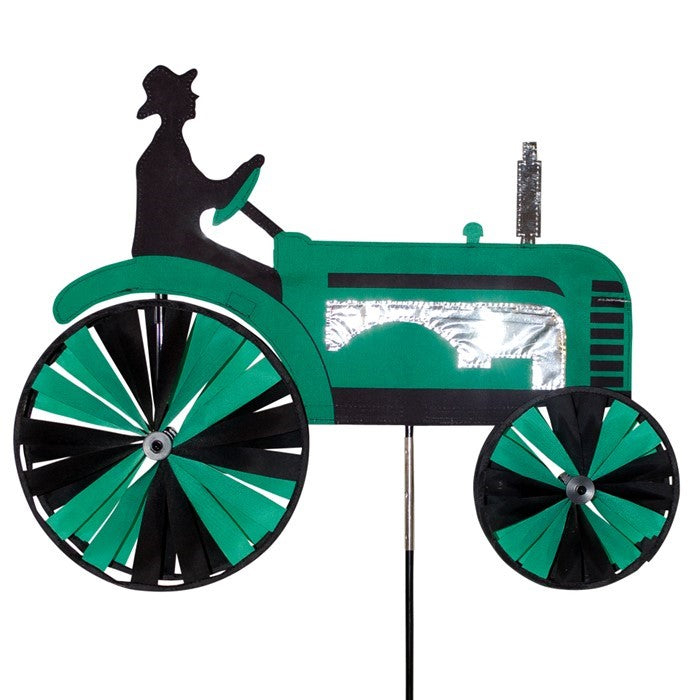 24-inch Green Tractor Spinner with four spinning wheels, vibrant design, and fiberglass frame displayed in a sunny garden setting.