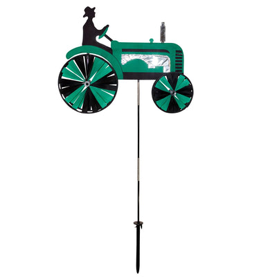 24-inch Green Tractor Spinner with four spinning wheels, vibrant design, and fiberglass frame displayed in a sunny garden setting.