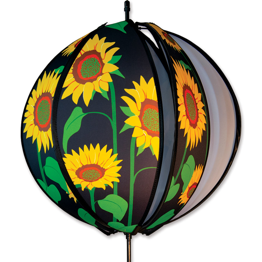 24 in. Ball Spinner - Sunflowers with six colorful panels featuring sunflowers, spinning gracefully on a garden ground stake in an outdoor setting.