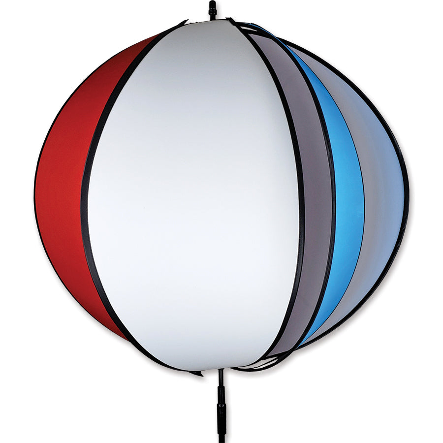 Colorful 24 in. Beach Ball Spinner displayed in a garden, featuring a vibrant beach ball design, spinning gently in the breeze.