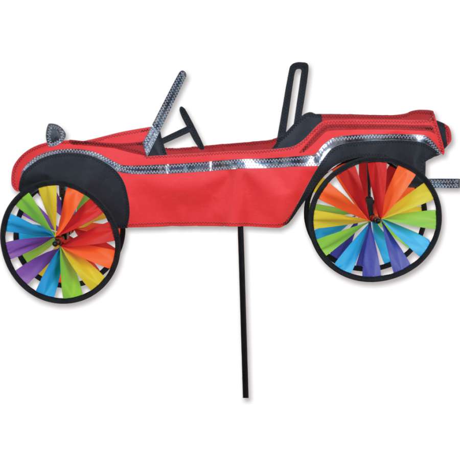 24 in. Dune Buggy Spinner featuring vibrant colors and whimsical design, spinning joyfully in a garden setting under sunlight.