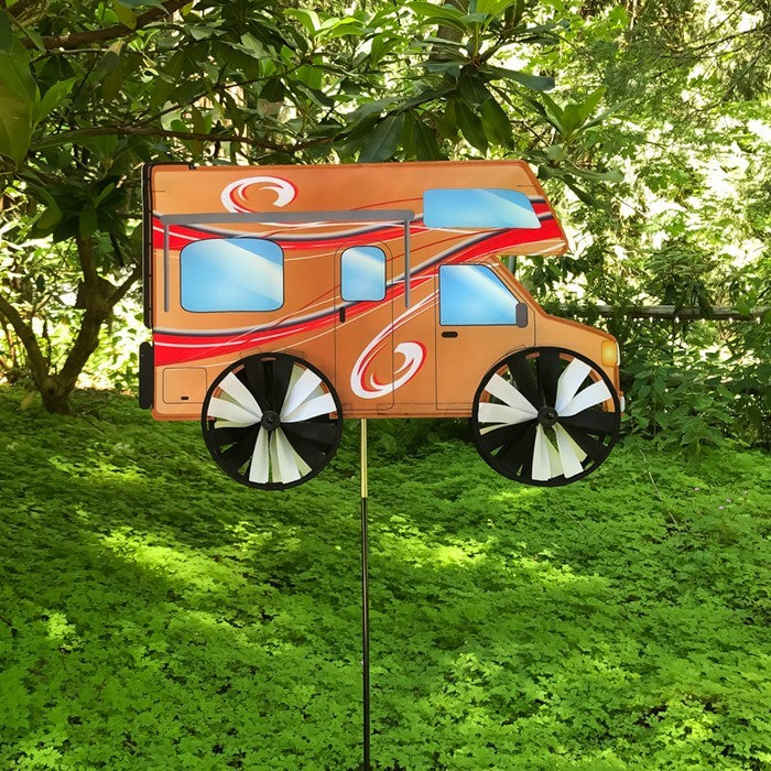 24-inch Motorhome Spinner with vivid design, featuring four spinning wheels, displayed in a grassy outdoor setting, representing outdoor adventure.
