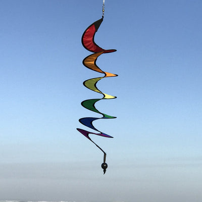 24-inch Rainbow Curlie hanging outdoors, showcasing vibrant colors in swirling patterns, dancing in the breeze with sunny background.