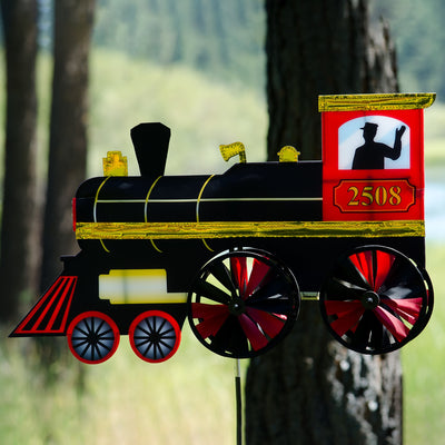 24-inch Steam Engine Spinner with vibrant colors and shiny applique accents, spinning gently in a garden setting, evoking retro train nostalgia.