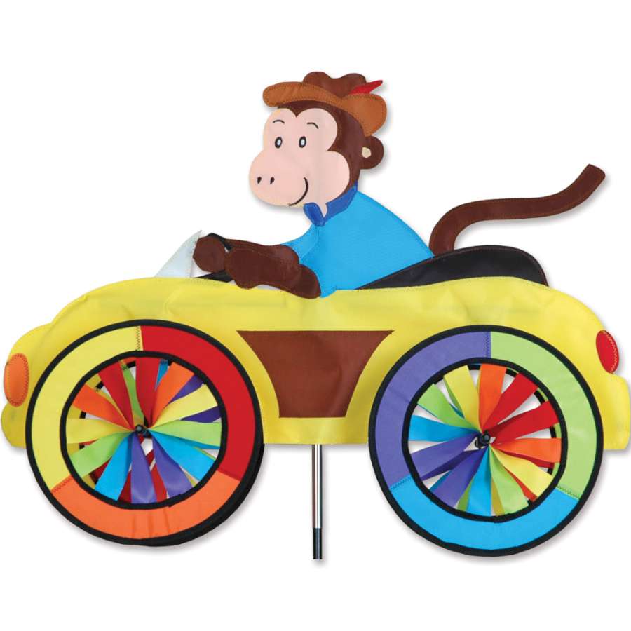 25 inch Car Spinner featuring a playful monkey design, spinning brightly in a garden setting with colorful wheels in motion.