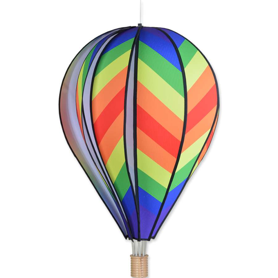 26 in. Hot Air Balloon - Traditional Rainbow design spinning in the breeze, adding vibrant color to an outdoor garden setting.