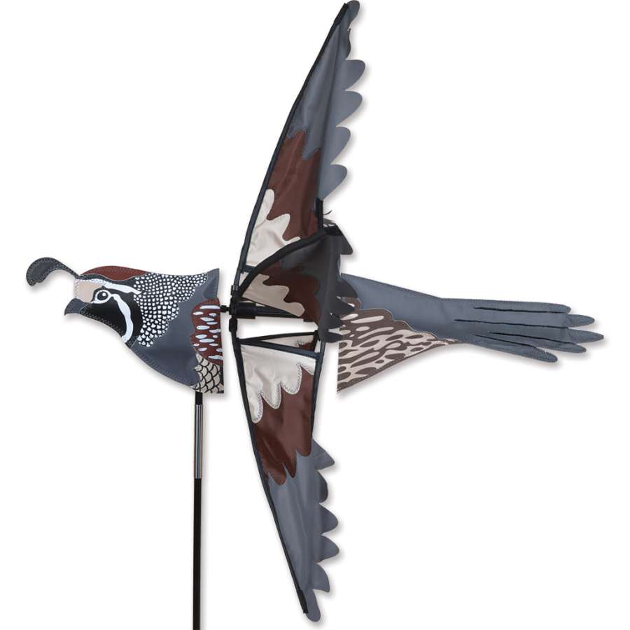 Colorful 26 in. Quail Spinner displayed in a garden, featuring vibrant quail designs that spin elegantly in the breeze.