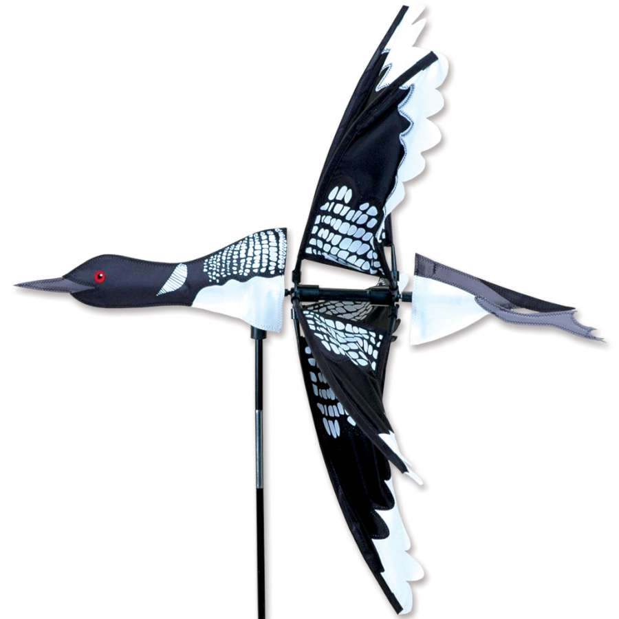 27 in. Flying Loon Spinner featuring colorful loon design rotating gently in the breeze, brightening up a garden setting.
