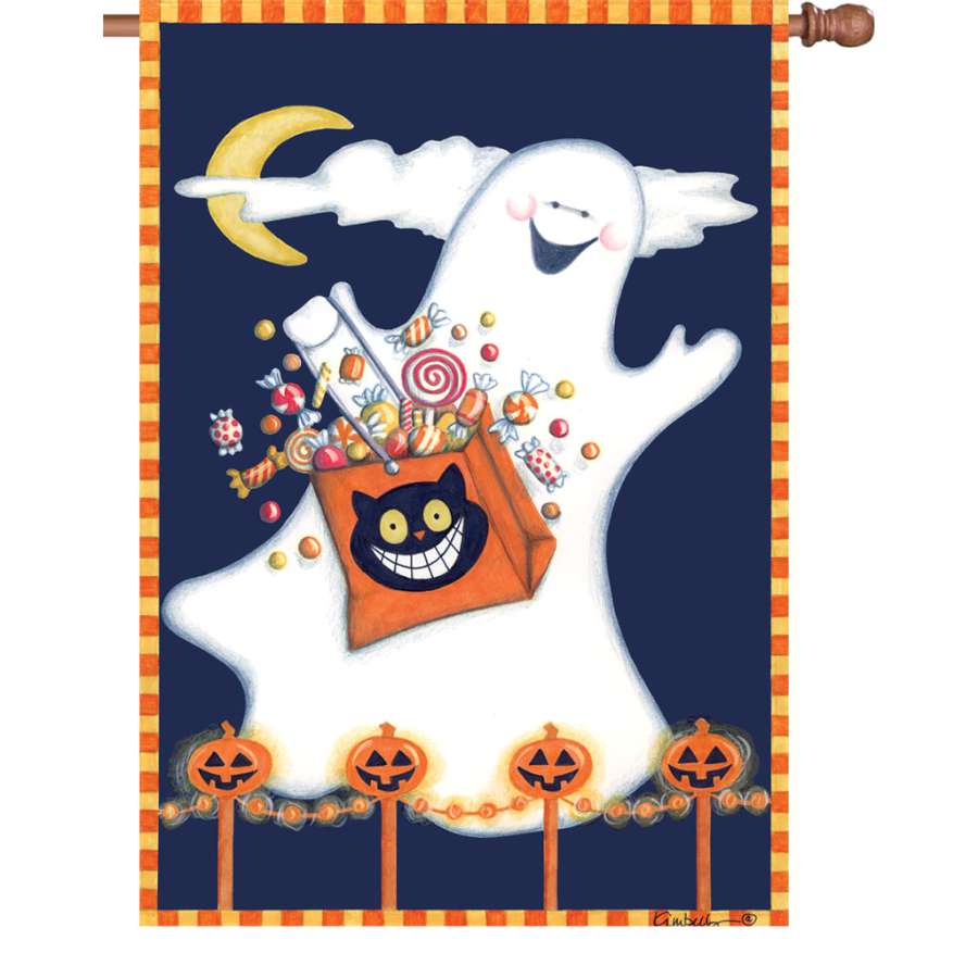 28 in. illuminated Candy Ghost flag with vibrant colors displayed in a garden, showing unique ghost design glowing at night.