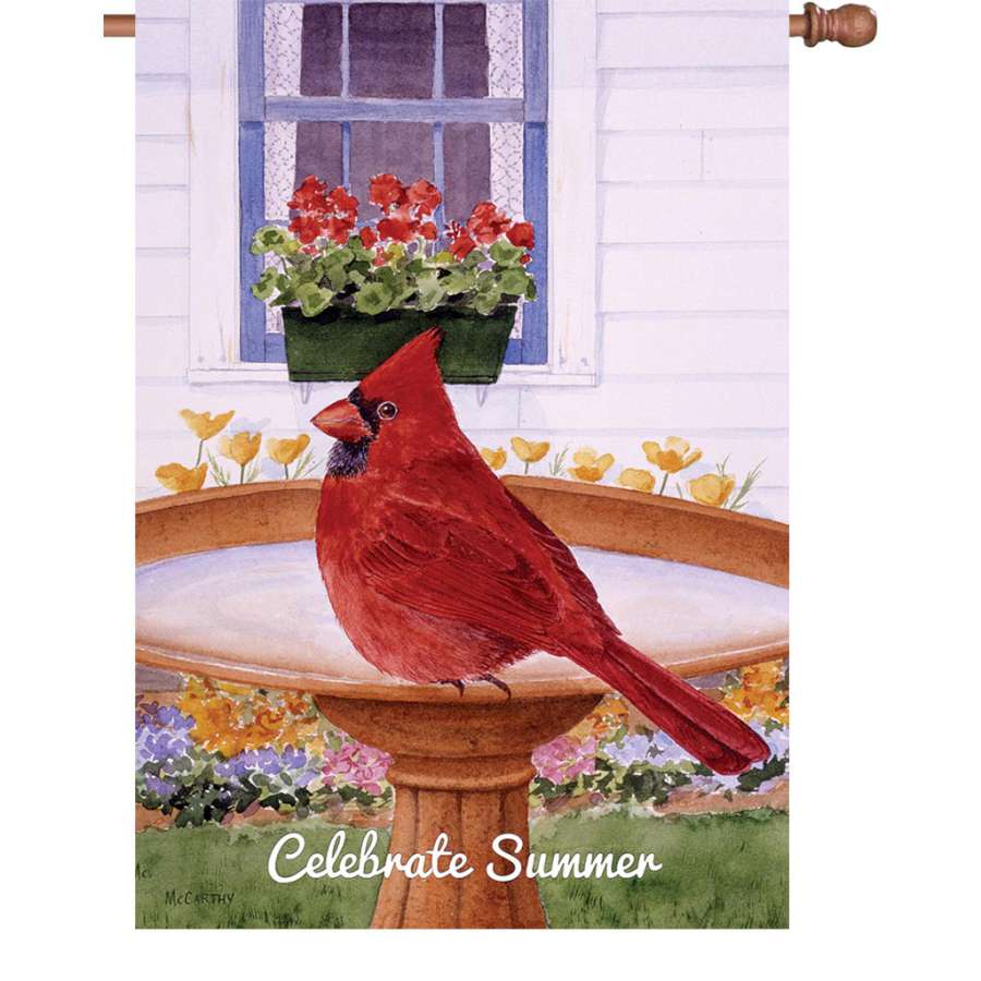 28 in. Cardinal and Geraniums flag design featuring bright red cardinals and blooming geraniums displayed on an outdoor flag stand.